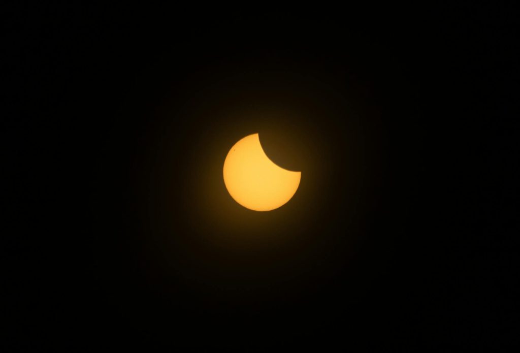 dramatic solar eclipse with sunlit corona