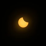 dramatic solar eclipse with sunlit corona